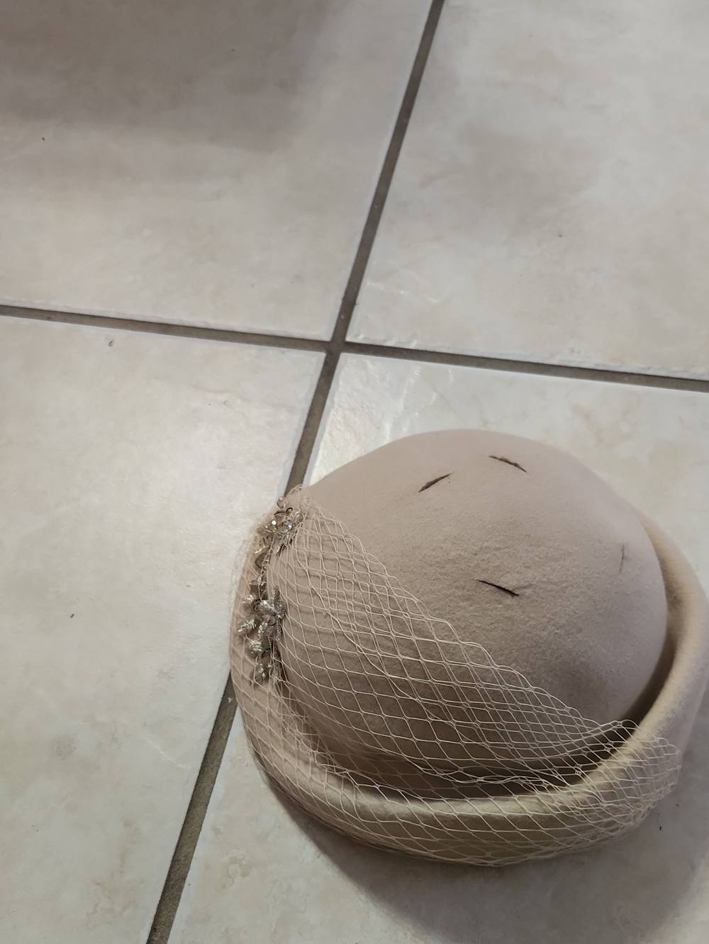 Beige Wool Fascinator Hat with Decorative Veil and Embellishment